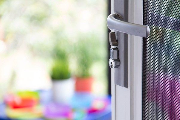 Elegant and Secure Heavy-Duty Screen Door with Lock An elegant, heavy-duty screen door featuring a durable mesh security screen and a secure locking mechanism.
